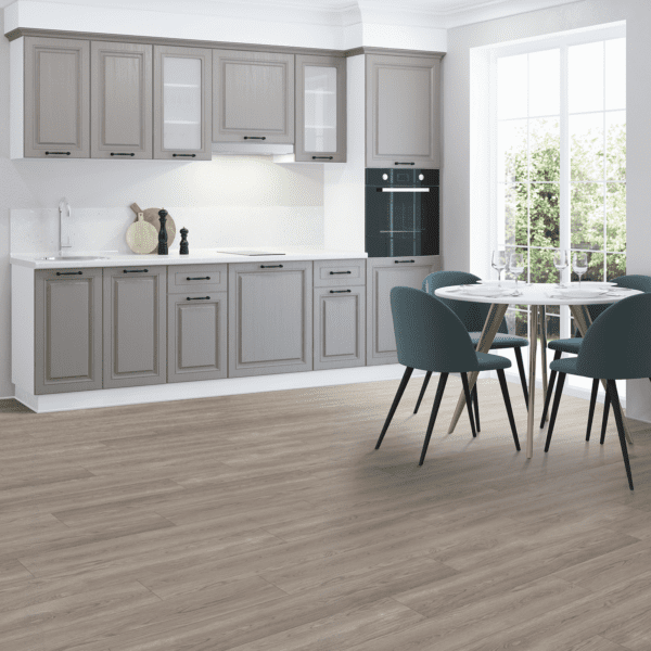 A kitchen with grey cabinets and gray walls.