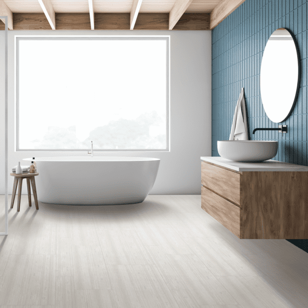 A bathroom with a tub, sink and mirror.