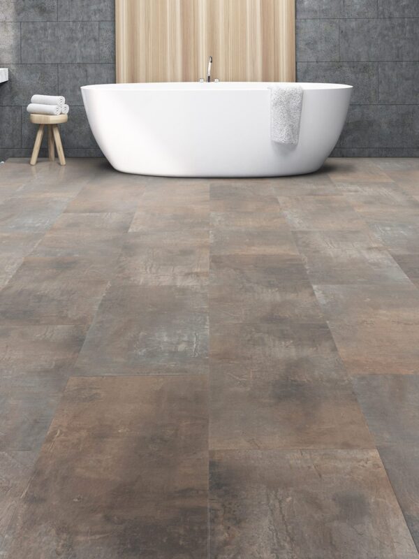 A bathroom with a tub and tiled floor