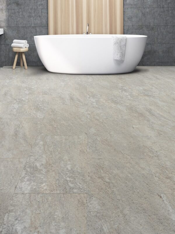 A white tub sitting next to a sink.