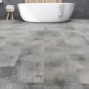 A bathroom with a tub and tiled floors