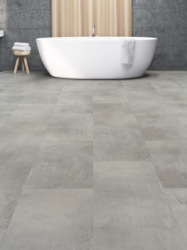 A bathroom with a tub and tiled floors