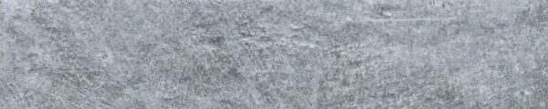 A close up of the ground surface of a stone wall.