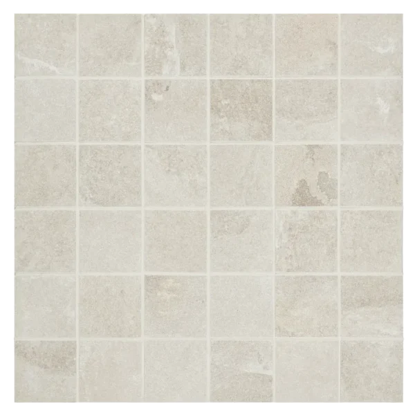 A white tile floor with some small squares