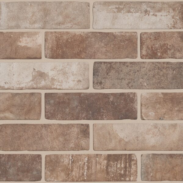 A brick wall with different colors of bricks.