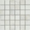 A white tile floor with some small squares