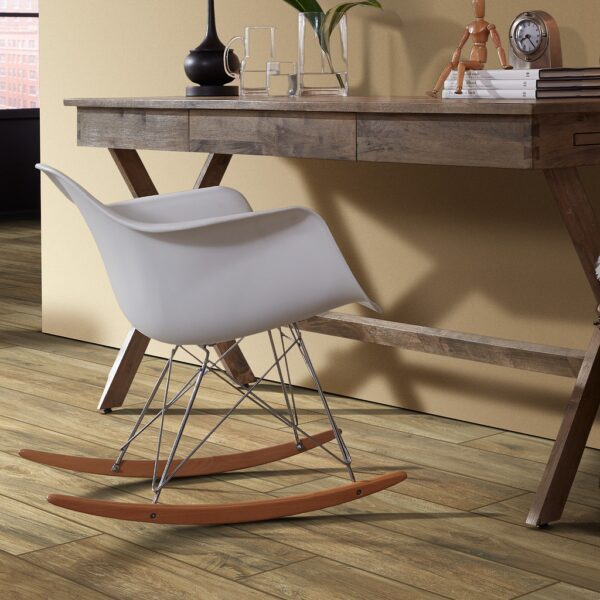 A wooden desk with two white chairs and a table