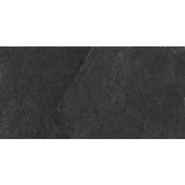 A black stone wall with some white writing on it