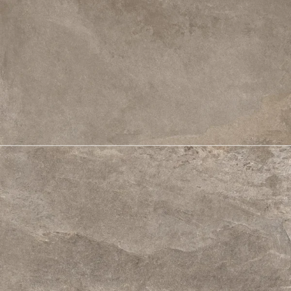 A close up of the surface of a stone wall.