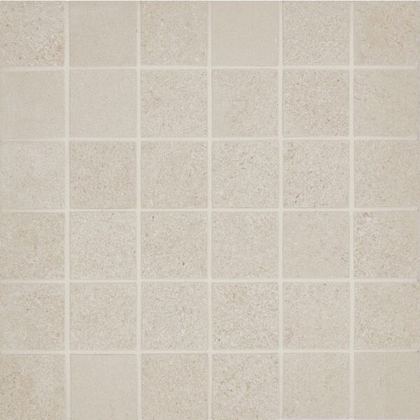 A white tile floor with some small squares