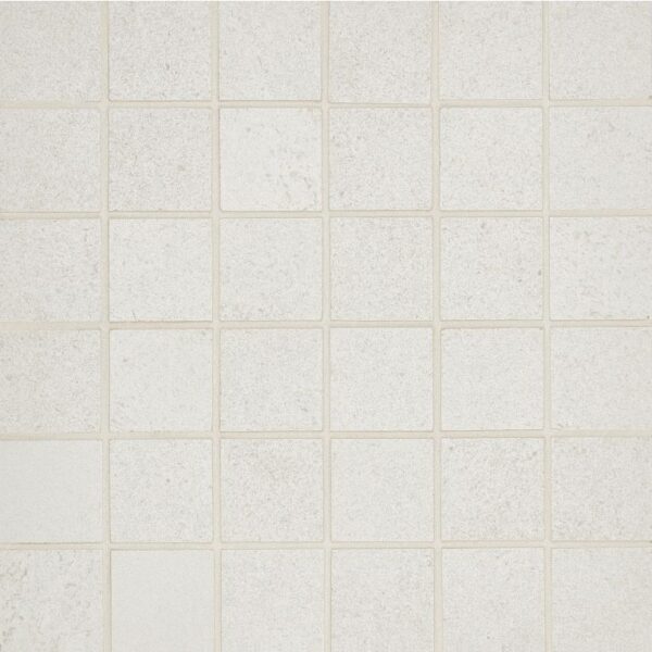 A white tile floor with some small squares