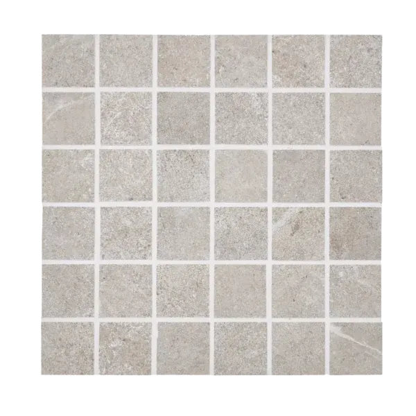 A white tile floor with some small squares