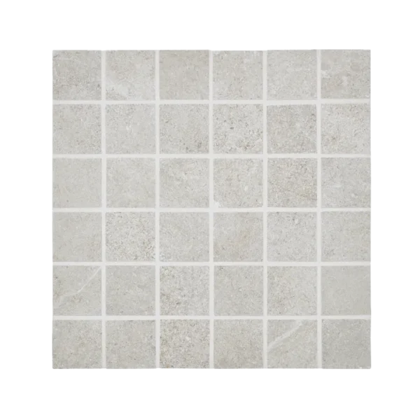 A white tile floor with black border
