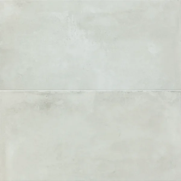 A white tile floor with some clouds in the background
