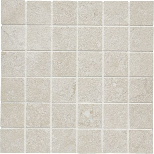 A white tile floor with some small squares