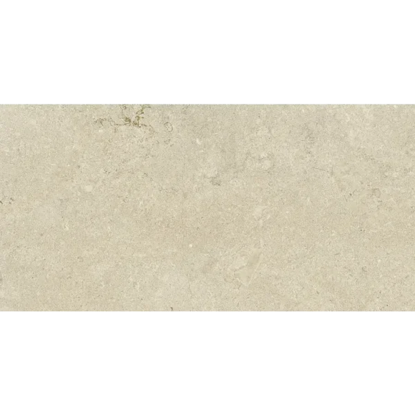 A white tile with some small bubbles on it
