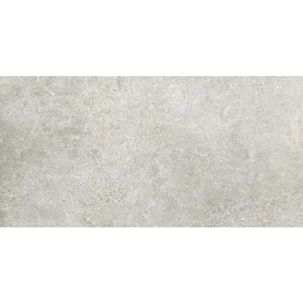 A white stone wall with some type of substance on it