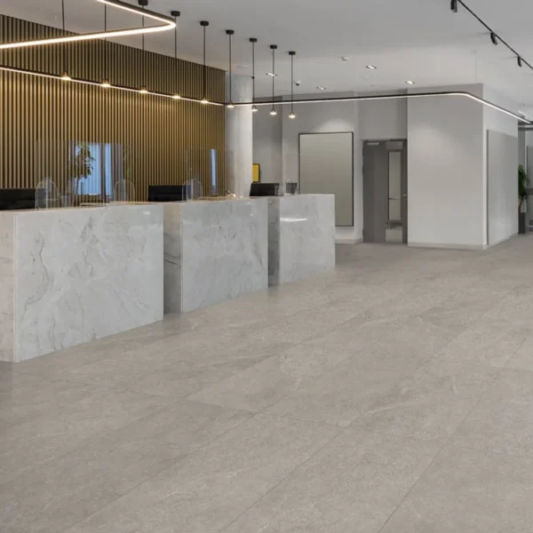 A large lobby with marble floors and walls.