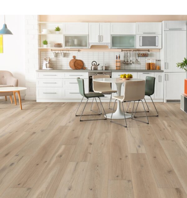 A kitchen with wooden floors and chairs