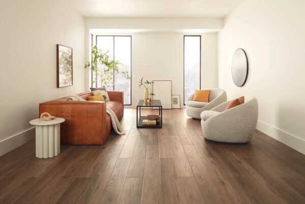 A living room with wooden floors and white walls.