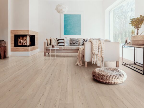 A living room with white walls and wooden floors