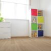A room with a white wall and wooden floors