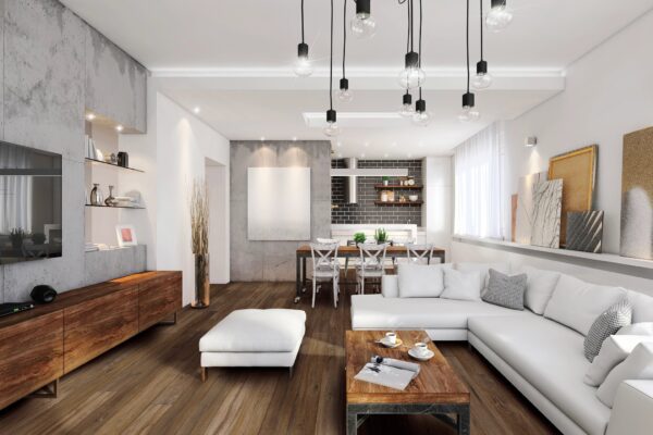 A living room with white furniture and wooden floors.