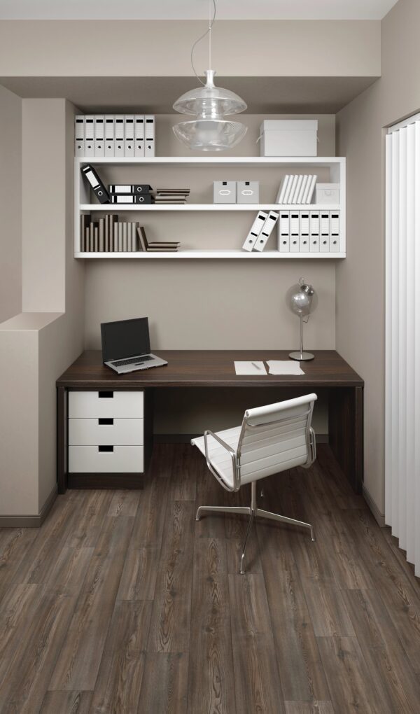 A desk with a laptop and chair in front of it.