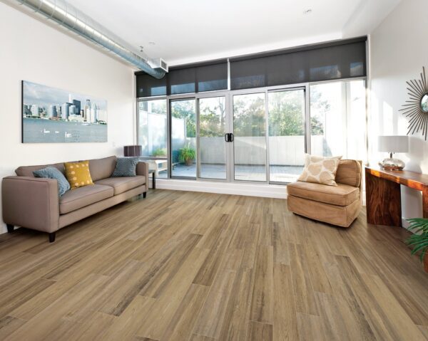 A living room with hardwood floors and sliding glass doors.