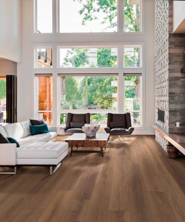 A living room with a couch and chairs in it