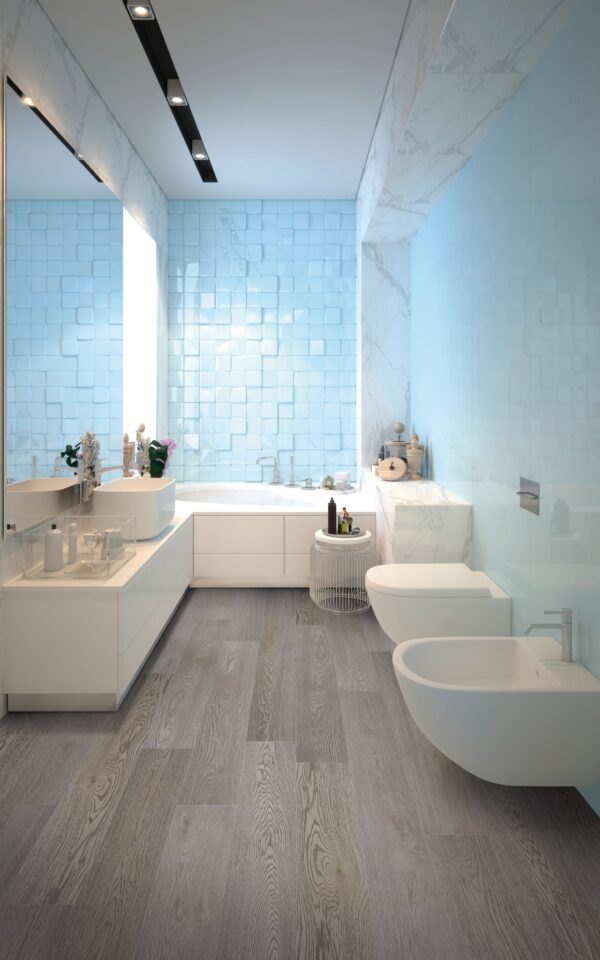 A bathroom with a toilet, sink and bathtub.