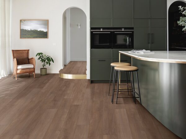 A kitchen with wooden floors and a counter top.