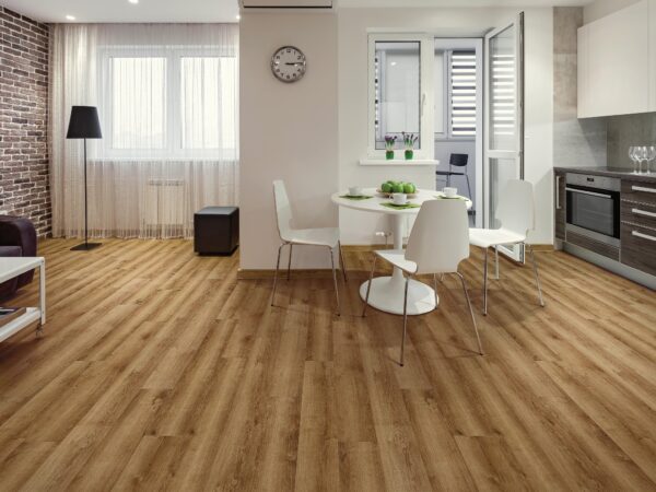 A room with wooden floors and white chairs.