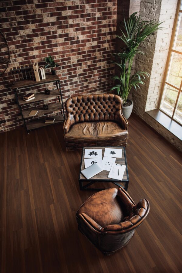 A living room with two chairs and a table