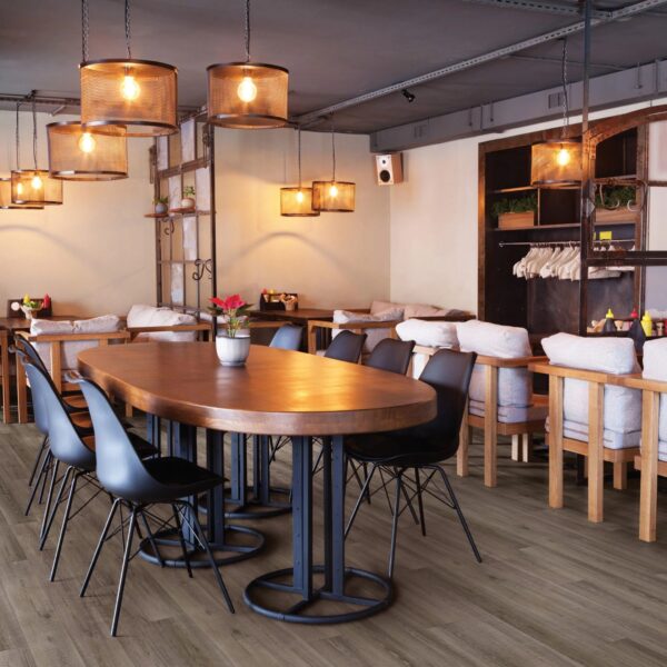 A restaurant with many chairs and tables in it