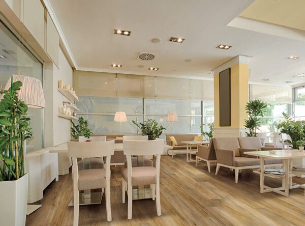 A room with many chairs and tables in it