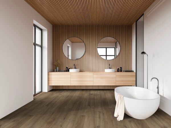 A bathroom with two sinks and a tub.