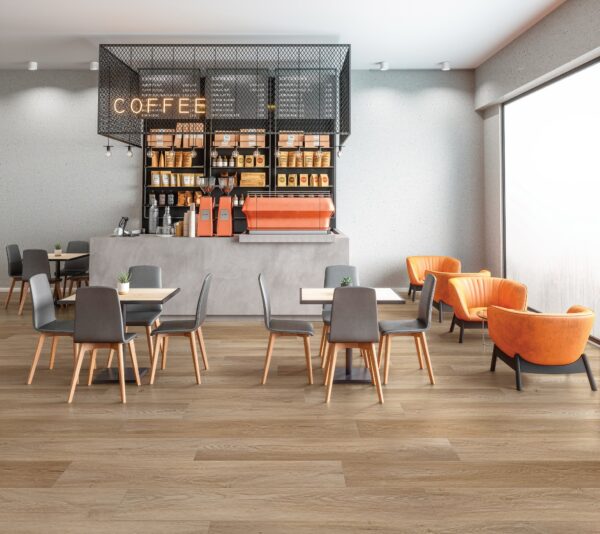 A coffee shop with chairs and tables in front of the counter.