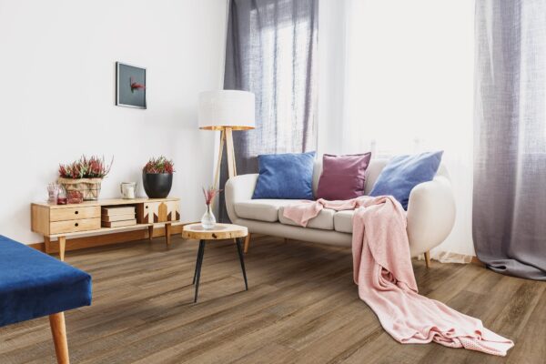 A living room with a couch and table