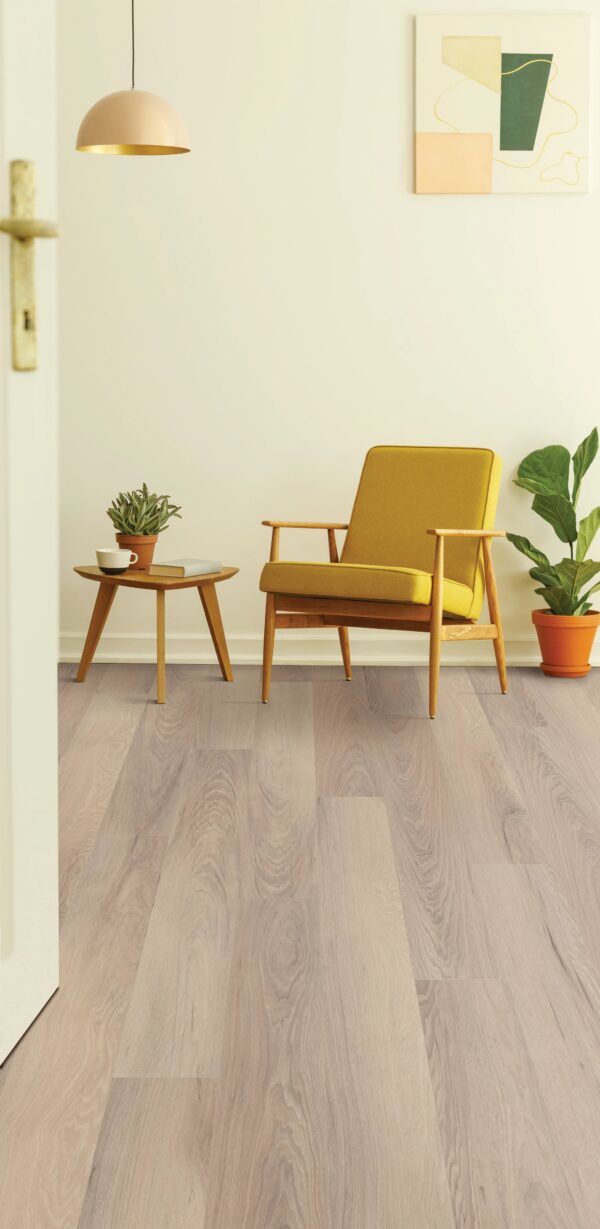 A yellow chair and table in a room.