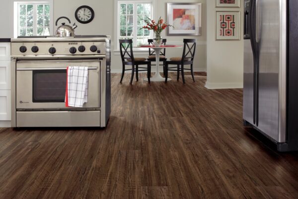A kitchen with wooden floors and a stove.