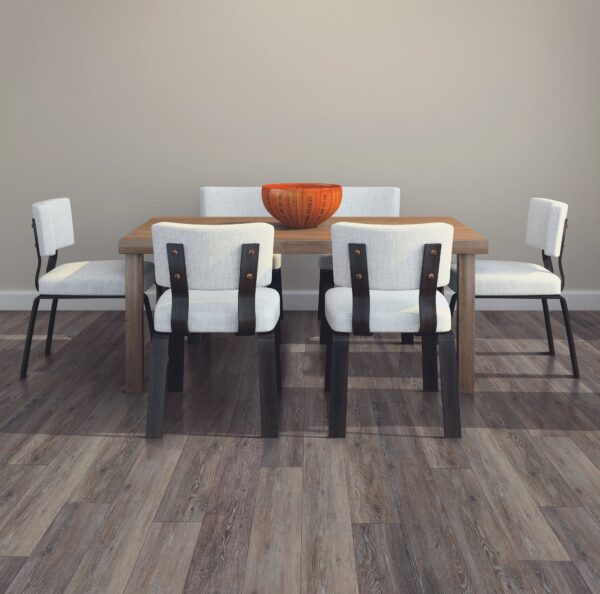 A dining room table with six chairs and an orange bowl.