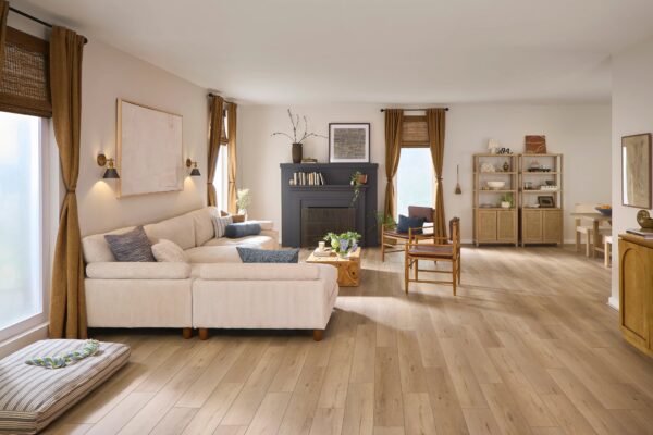 A living room with wood floors and white couches.