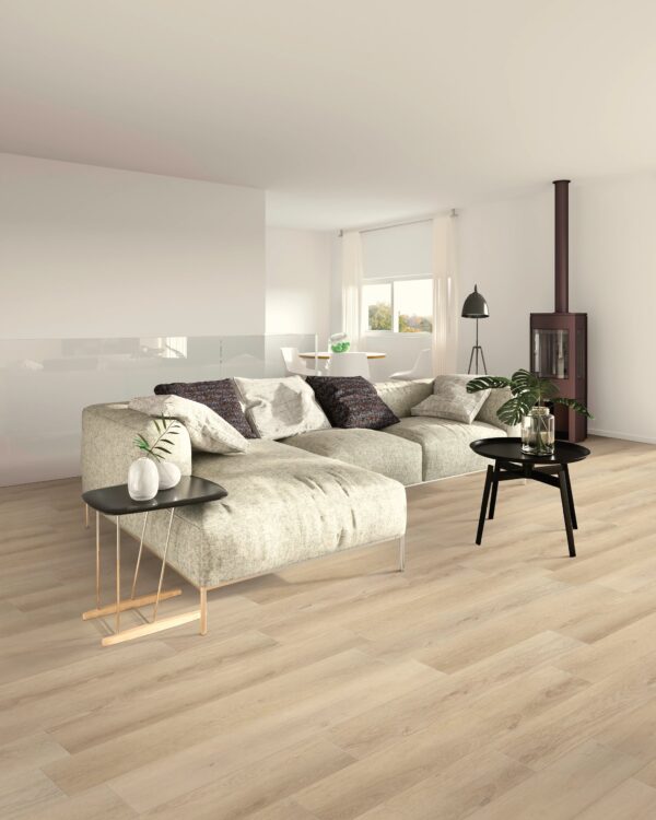 A living room with white furniture and wood floors.