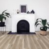 A fireplace with a white mantle and black trim.