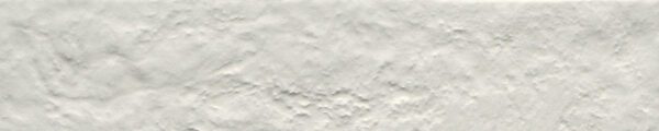 A white wall with some type of substance on it