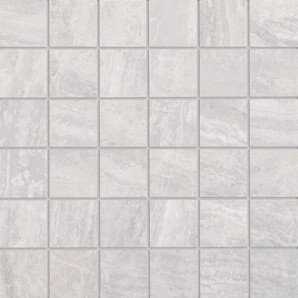A white tile floor with some small squares