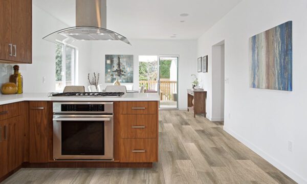 A kitchen with wood floors and a stove.